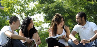 International students on grass outside Library